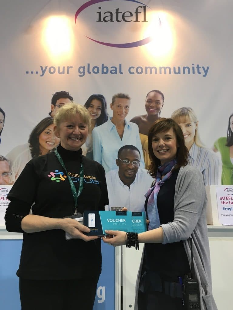 Marianne handing Pronunciation Club app vouchers to Lisa Duckworth of IATEFL